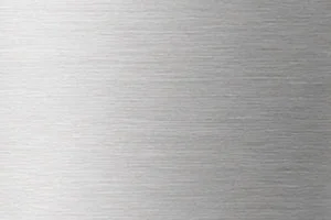 Close-up of a brushed metal texture with fine horizontal lines creating a sleek, industrial appearance.